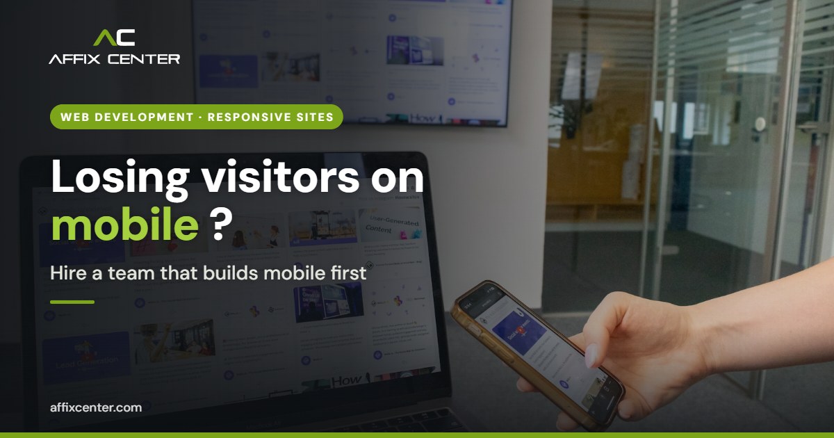 Person holding a phone in front of a laptop, for a guide to hiring a responsive web development company